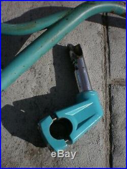 Redline used old school BMX turquoise fork-lifter bars and stem from a RL20II